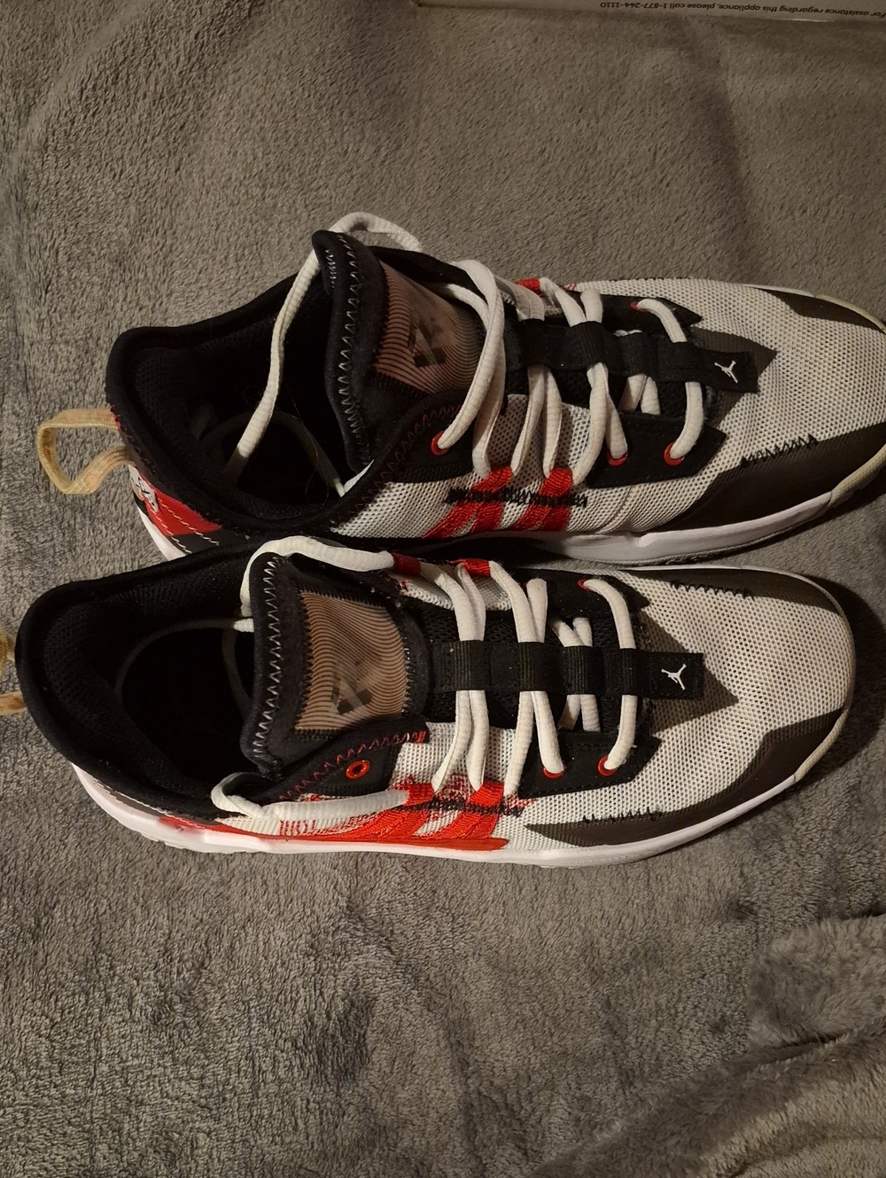 Jordan Menโs White, Black & Red Low-Top Sneakers